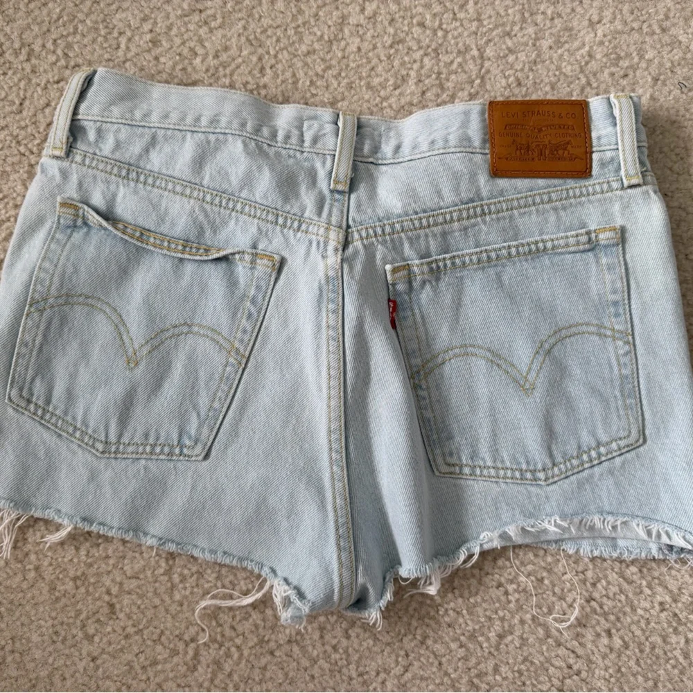 Levi’s Women’s Light Blue Distressed Denim Shorts